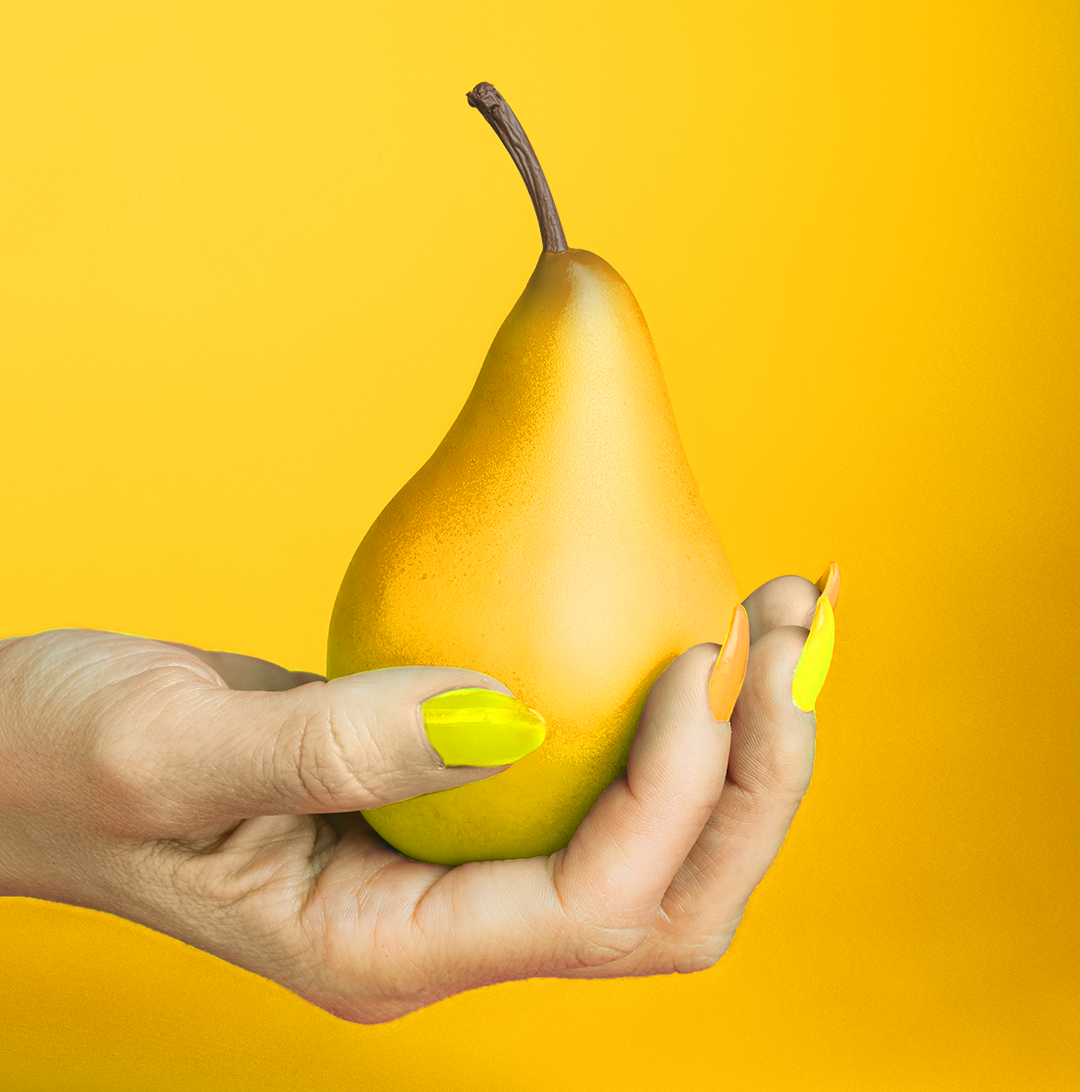 woman-hand-holding-pear